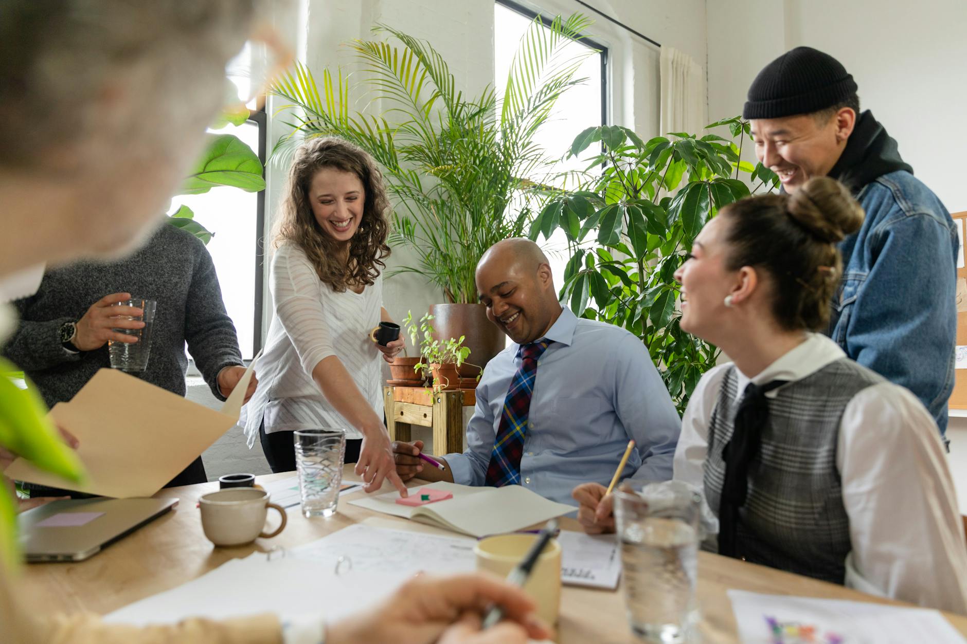 Diverse group of office workers collaborating in a positive setting.